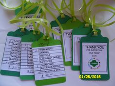 four tags that say thank you and have green ribbons attached to them with the words thank you