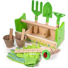 a wooden garden tool set with gardening tools and other things to make it easier for kids to play