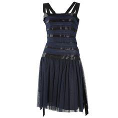 This gorgeous navy and black and ribbon Chanel runway dress is one of a kind. Gorgeously classic, but a show stopper. CHANEL 06A Runway Black silk ribboned dress with a square neckline and ribbon straps. The silhouette is a drop waist - slim and the skirt hits below the hip (very flapper 20s style). Ribbon detail all around the dress. It is pleated with loose ribbons hanging over top of tulle to give it movement while you walk. It's a showstopper! Size 38 1995 Runway, Black Chiffon Skirt, Dusty Pink Bridesmaid Dresses, Chanel Dresses, Beaded Flapper Dress, Cocktail Dress Yellow, Summer Cocktail Dress, 1st Dibs, Chanel Runway