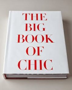 the big book of chic is sitting on top of a white table with red lettering