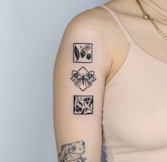 a woman's arm with four different tattoos on her left shoulder and the other side