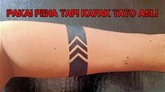 a person with a black and white tattoo on their arm that says paka pena tapi kava tao asli