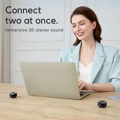 a woman sitting at a table with a laptop computer in front of her and the caption reads connect two at once