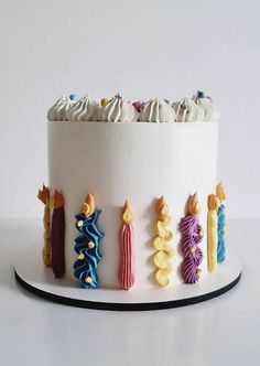 there is a cake decorated with candles and icing