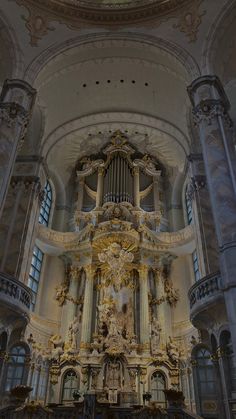 the inside of a church with an ornate organ in it's center and ceiling