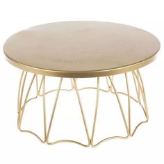 a round coffee table with gold metal frame and beige top, on a white background