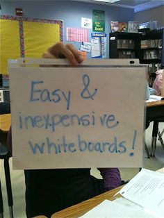 a sign that says easy & expensive whiteboards in front of a classroom with desks