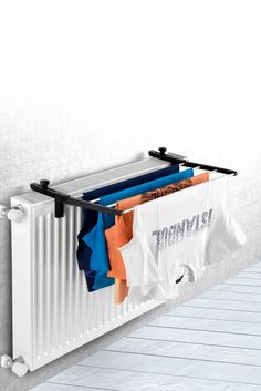 a radiator with clothes hanging from it