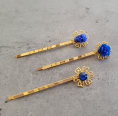 3 pcs Hair Bobby Pins set - Gothic Punk Rock Romantic Steampunk in Gold and Blue 3 pcs of hair pins in Gold and Blue - Skull/flowers. Each of my items is one of a kind and unique.  All the items are made according to what I find special and pretty, but you are more than welcome to ask for any changes that come on your mind. I promise I'll do my best to make it happen.  You will not find another person anywhere in the world wearing the exact same item as yours.  I use the best materials for this kind of fashion, and enjoy creating each item very much. Hope you like my items as I do :)  I do my best to keep my prices low, and you can buy as many items as you like on the same low shipping cost. I ship registered mail worldwide in order to secure your purchase and it usually takes about 3 week Blue Steampunk, Steampunk Clothes, Hair Bobby Pins, Skull Flowers, Blue Skull, Blue Skulls, Bear Necklace, Gold And Blue, Flower Skull