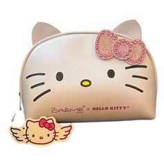 a hello kitty purse with a pink bow on it