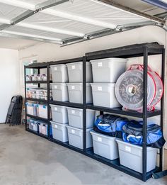 the storage room is filled with plastic buckets and various other containers, including one wheel