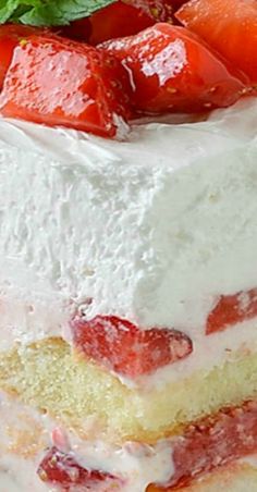 a close up of a cake with strawberries on top