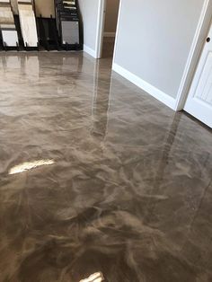 the floor is clean and ready to be used as a coating for concrete floors in an empty room