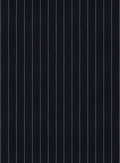 a black and white striped wallpaper with vertical lines on the bottom half of it