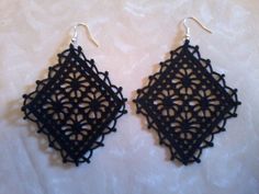 black crochet earrings on white background