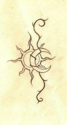 a drawing of a sun and moon on a piece of paper