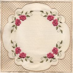 a white doily with pink flowers on it