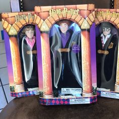 three harry potter action figures in their packaging