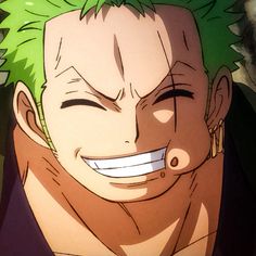 an anime character with green hair smiling at the camera while looking to his left side