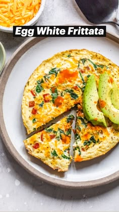 an omelet with avocado and cheese is on a plate next to other ingredients