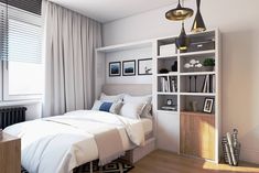 a bedroom with a bed, bookshelf and pictures on the wall