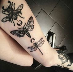 a woman's legs with tattoos on them and dragonflies in the middle of her leg