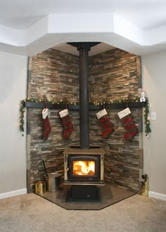 a fireplace with stockings hanging from the mantle