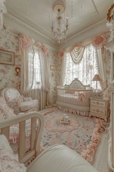 a baby's room is decorated in pink and white with roses on the walls