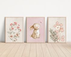 three framed art prints with flowers and a bunny on the left, one in pink