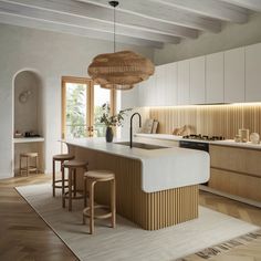 a kitchen with an island and stools in it