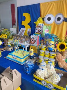 the table is set up for a despicable birthday party with minion decorations