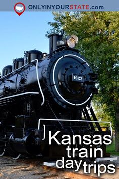 a black train engine sitting on the tracks with trees in the background and text that reads kansas's train day trips