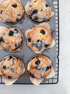 blueberry muffins cooling on a baking rack