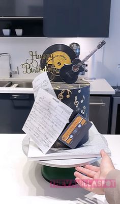 a cake with musical notes on it sitting on top of a table