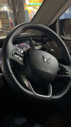 the steering wheel and dashboard of a car