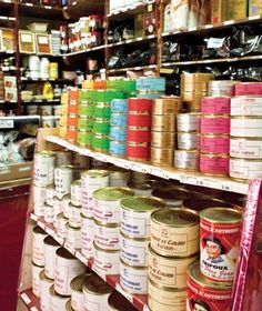 the shelves are full of canned food and other items on display in the store's aisles