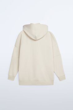 Roomy Sweatshirt With Hooded Mock Neck And Long Sleeves. Hidden In-Seam Chest Pocket. Contrasting Front Printed Text. Ribbed Trim. Zara Cotton Sweatshirt For Streetwear, Zara Casual Cotton Sweatshirt, Zara Oversized Cotton Sweatshirt, White Cotton Zara Sweatshirt, Casual White Zara Sweatshirt, White Crew Neck Sweatshirt By Zara, White Zara Crew Neck Sweatshirt, Zara White Crew Neck Sweatshirt, Oversized Zara Cream Tops