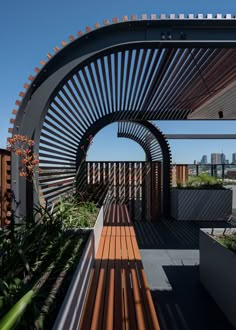 an outdoor area with wooden walkways and plants