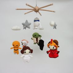 crocheted stuffed animals hanging from a ceiling