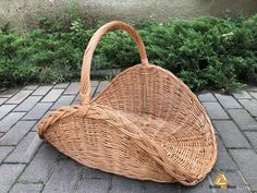 a wicker purse sitting on the ground