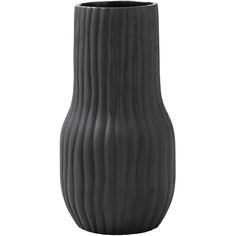 a black vase sitting on top of a white table