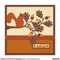 an autumn mouse pad with a squirrel and acorn tree design on the side, along with a computer mouse