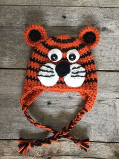 an orange and black crocheted tiger hat