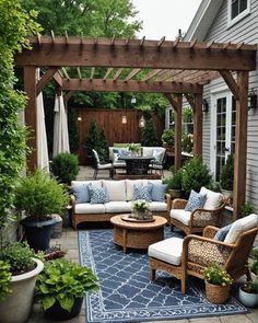 an outdoor living area with couches, chairs and tables in the middle of it