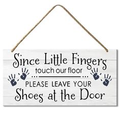 a sign that says, since little fingers touch our floor please leave your shoes at the door