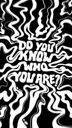 the words do you know who you are? written in white ink on black paper