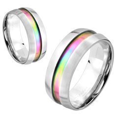 two rings with rainbow inlays are shown on a white background and one is silver