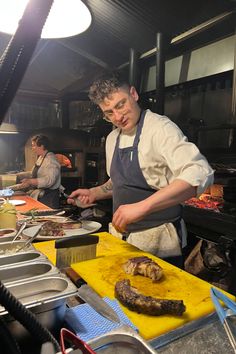 a man is preparing food in a kitchen