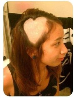 a woman with her hair in the shape of a heart