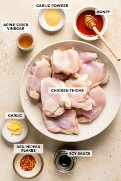 ingredients for chicken thighs on a white plate